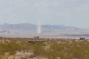 Big dust devil in the distance.